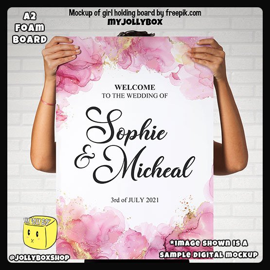 Digital mockup of a person holding a A2 size Pink and Gold Splashes theme welcome to wedding board