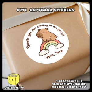 Digital-Mockup-of-Cute-Capybara-sitting-on-a-small-rainbow-Theme-Sticker-Design-A-Pasted-on-Gift-Box Digital mockup of a cute capybara round sticker design A pasted on gift box