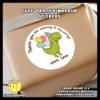 Digital-Mockup-of-a-Cute-Party-Dinosaur-With-Colorful-Balloons-Theme-Sticker-Design-B-Pasted-on-Gift-Box Digital mockup of a cute party dinosaur round sticker design A pasted on gift box